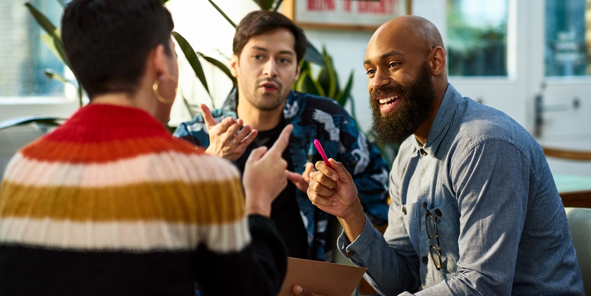 people conversing and smiling