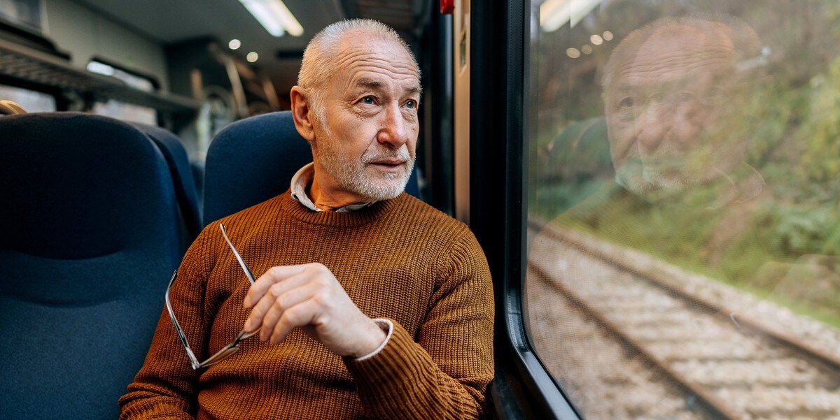 man travelling by train